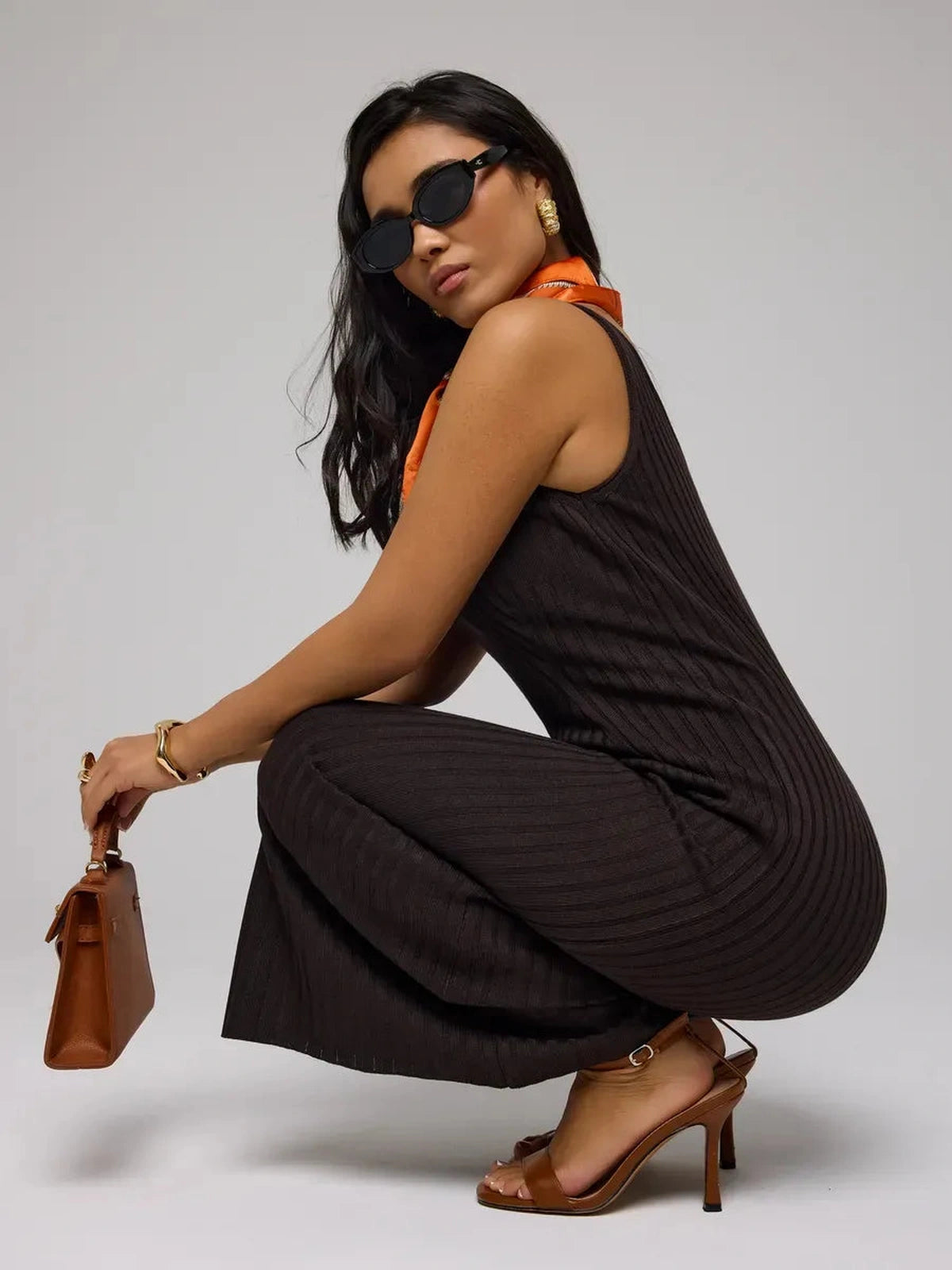 Model wearing Cacao Maxi Dress by Lauven, showcasing the chic brown ribbed knit design and stylish accessories.