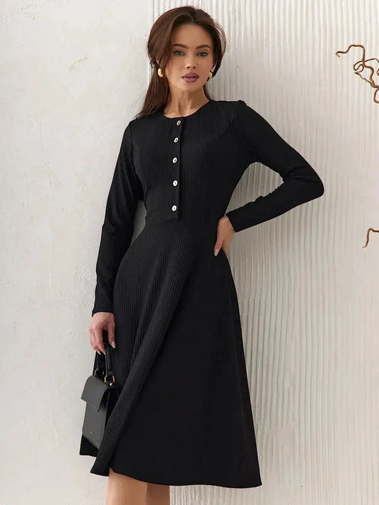 Serene Grace Midi Dress in black ribbed fabric featuring decorative buttons and a tailored silhouette, perfect for any occasion.