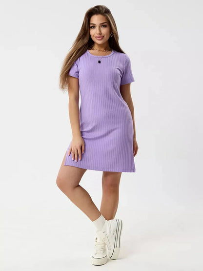 Model showcasing a lilac ripple mini dress with ribbed knit texture and short sleeves, perfect for warm days and lively nights.