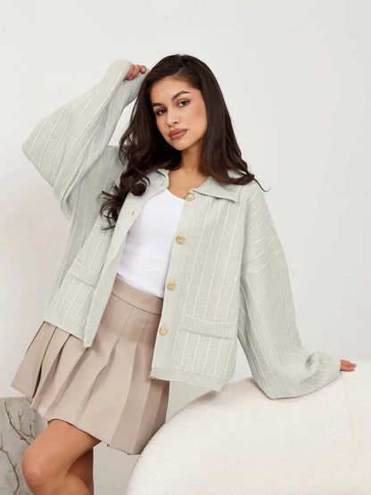 Glacier Cardigan by Lauven in light gray, featuring oversized silhouette and braided detail, perfect for stylish spring layering.