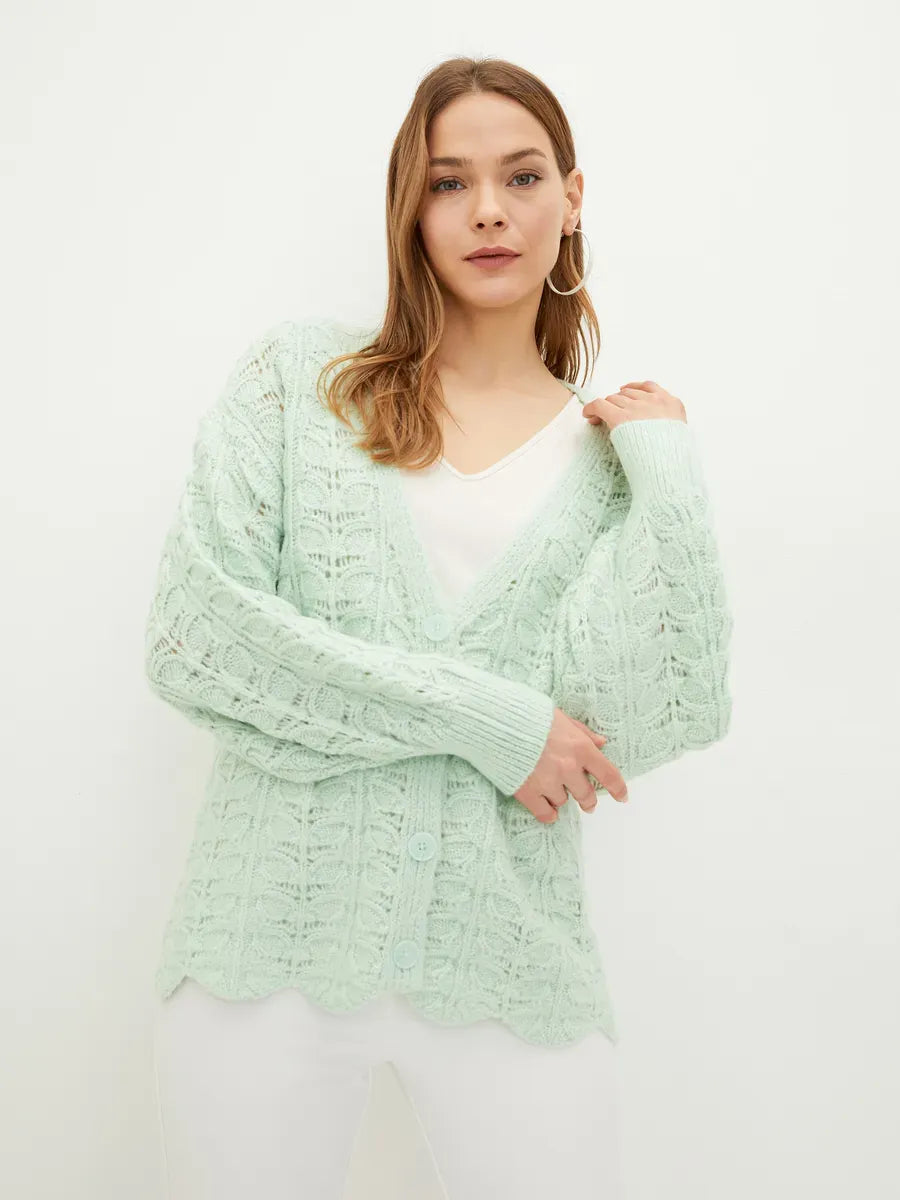 Celestia Cardigan by Lauven showcasing an elegant jacquard knit in soft green, featuring a flattering V-neckline.