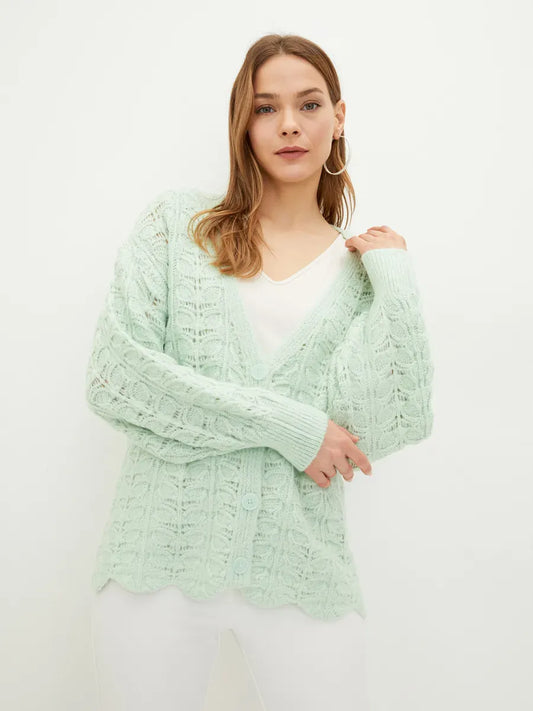 Celestia Cardigan by Lauven showcasing an elegant jacquard knit in soft green, featuring a flattering V-neckline.