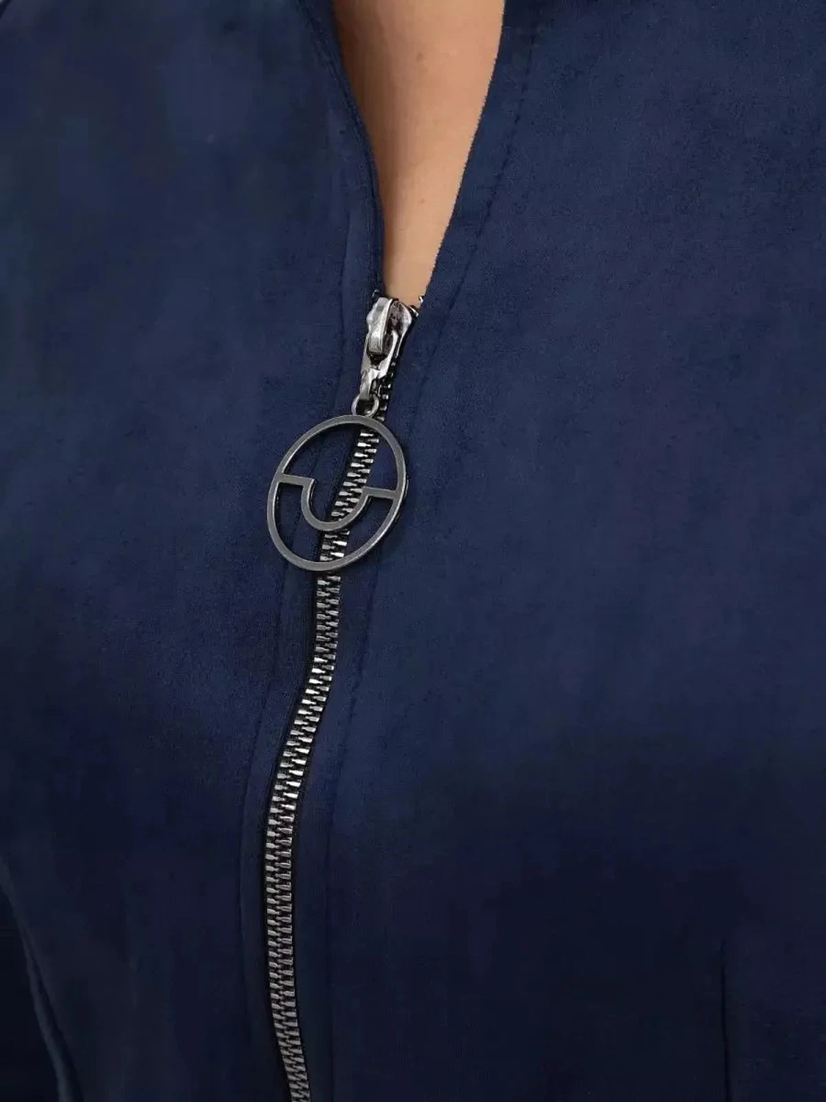 Close-up of the zip-front detail of the Orion Mini Dress by Lauven, showcasing modern elegance in navy fabric.