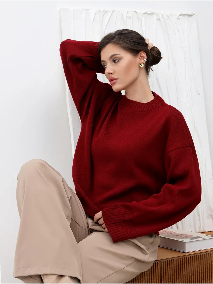 Valora Sweater in burgundy red worn by model, showcasing Lauven's oversized knit design for stylish comfort.