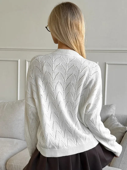 Ivory Cardigan by Lauven with delicate lace pattern seen from the back, highlighting its lightweight knit design.