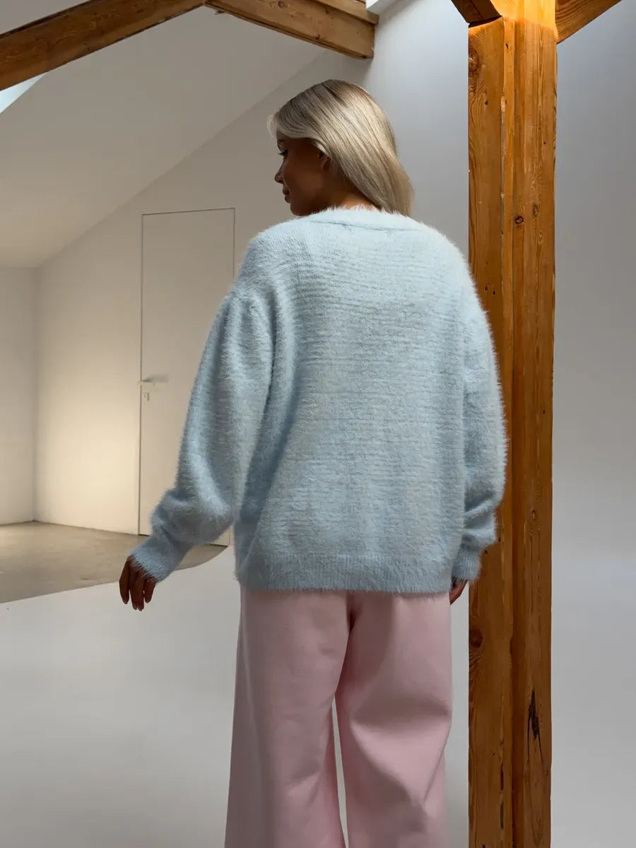 Azure Cardigan by Lauven, oversized light blue fluffy knit sweater, featuring a relaxed silhouette and soft texture.