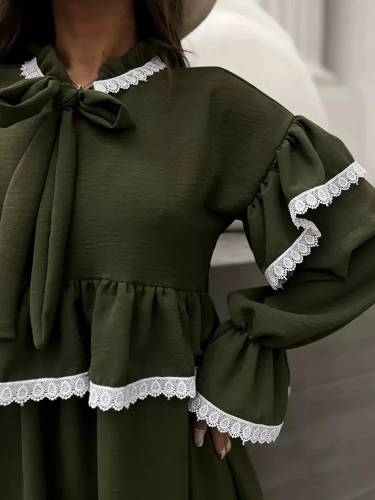 Olivea Mini Dress by Lauven featuring romantic ruffles and lace trim in khaki, showcasing a stylish and comfortable fit.