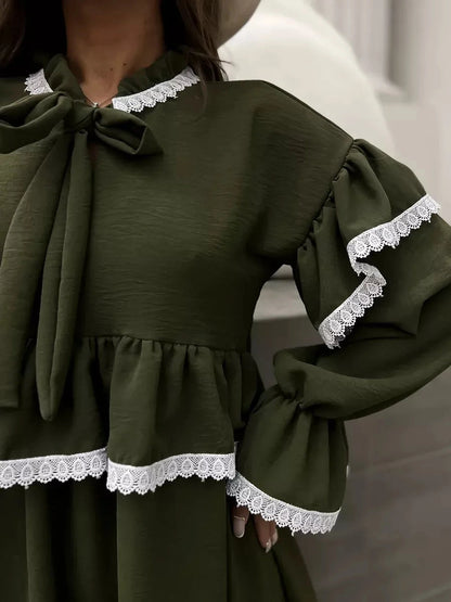 Olivea Mini Dress by Lauven featuring romantic ruffles and lace trim in khaki, showcasing a stylish and comfortable fit.