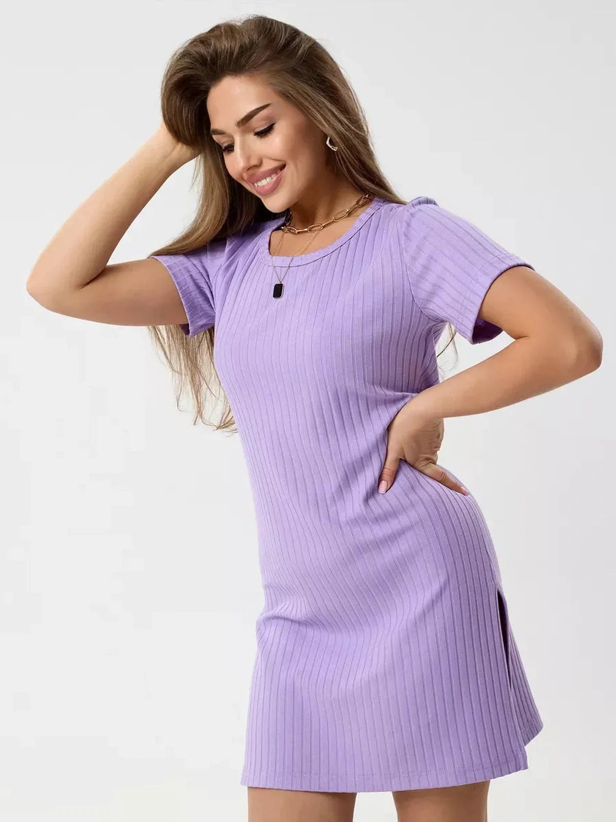 Model in a lilac ripple mini dress featuring ribbed texture, short sleeves, and side slits, perfect for warm days.