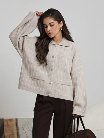 Dune Cardigan by Lauven in soft light beige, oversized knitwear with braided pattern and wide bell sleeves.