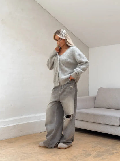 Eira Cardigan by Lauven in light gray fluffy knit worn with relaxed gray pants.