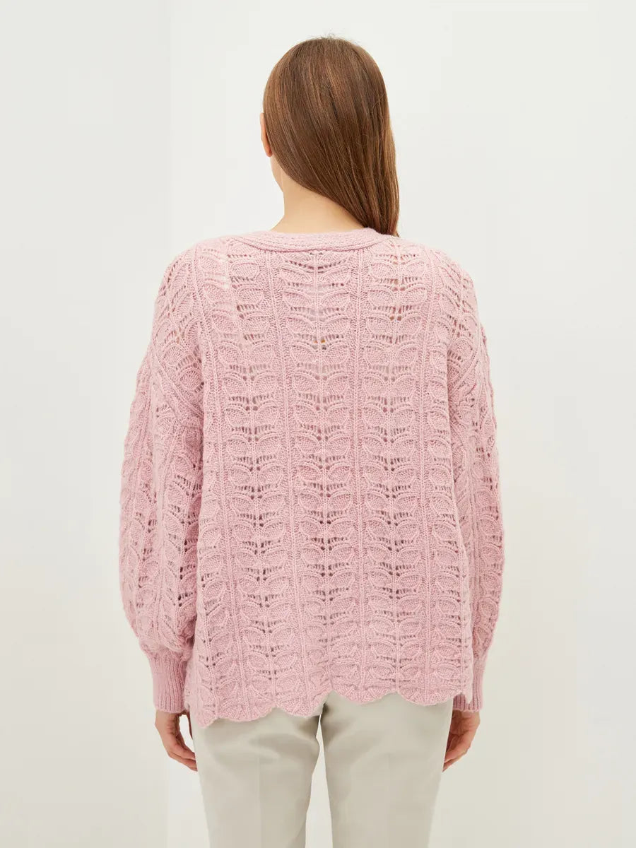Liora Cardigan by Lauven showing a soft pink jacquard knit pattern from the back, perfect for effortless style.