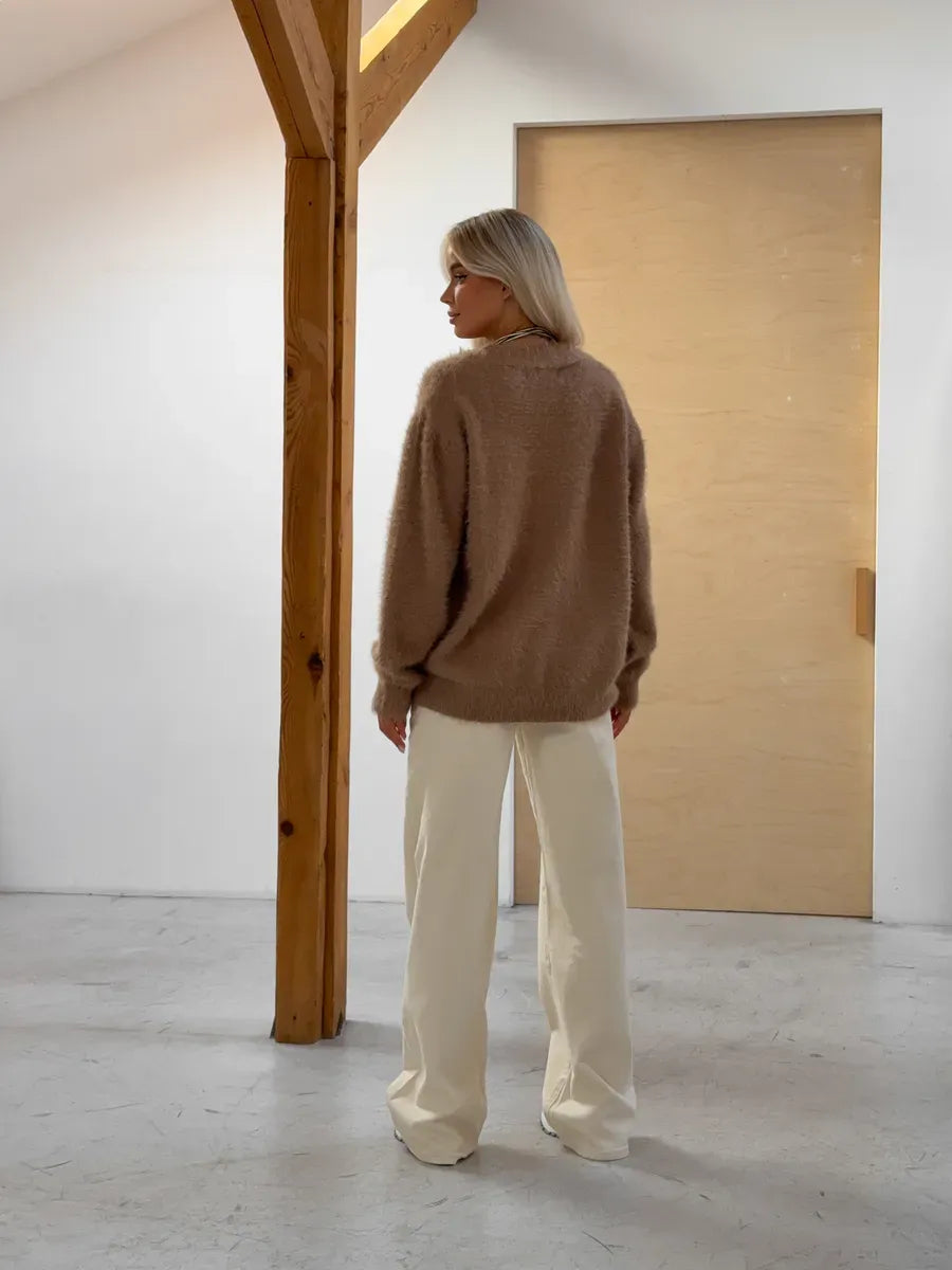 Marlo Cardigan by Lauven, oversized brown fluffy knit with button closure, styled casually in a modern interior.