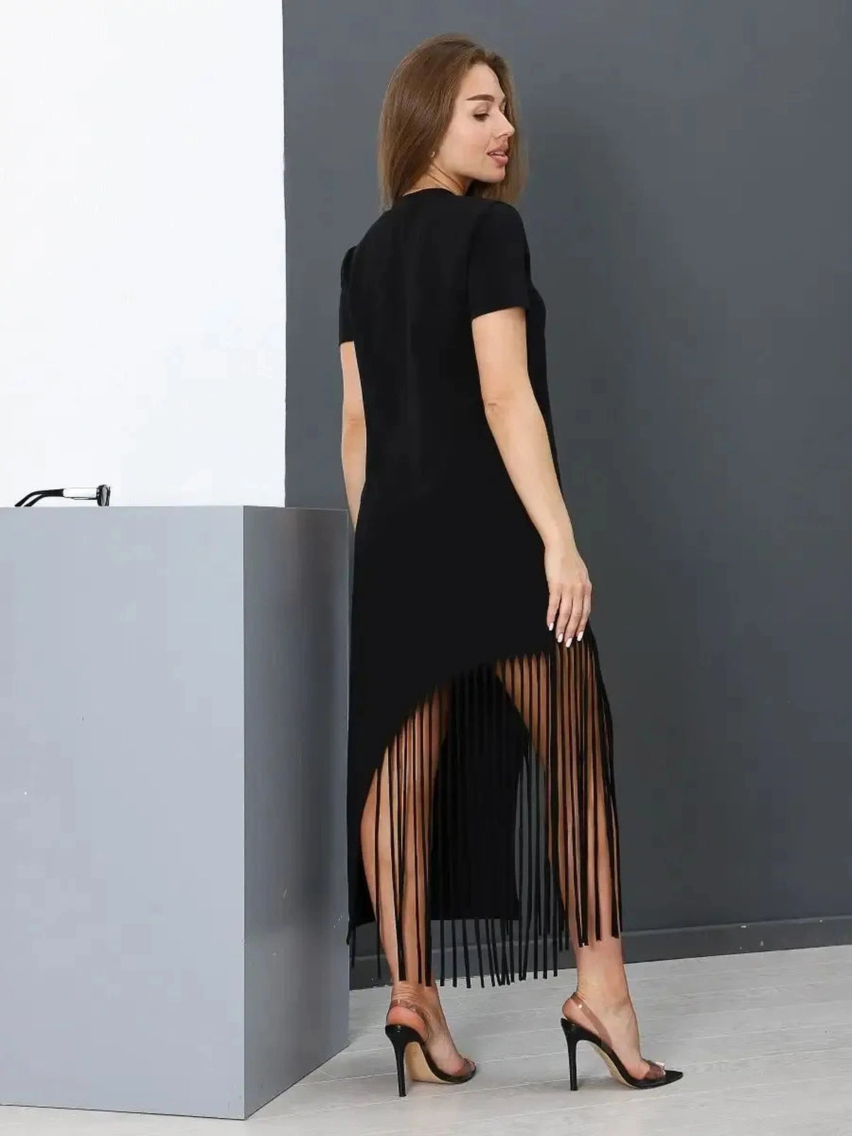 Noir Midi Dress by Lauven featuring a black cotton fabric with fringe hem for chic style and comfort.
