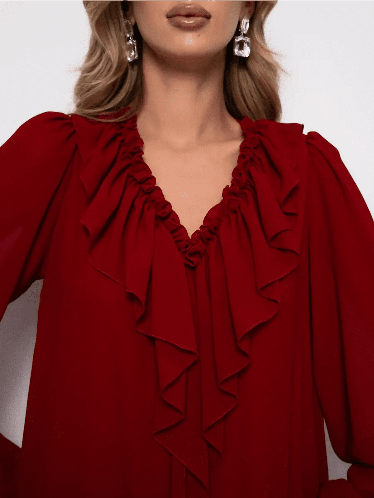 Close-up of the neckline of the Marsella Mini Dress by Lauven, featuring elegant ruffle detailing in wine-red chiffon.