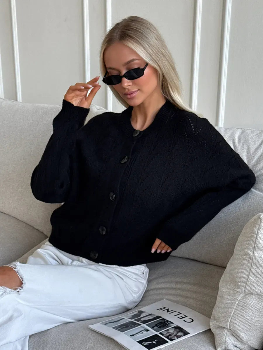 Onyx Cardigan by Lauven – Elegant button-up knit with soft textured fabric, styled with modern sunglasses.