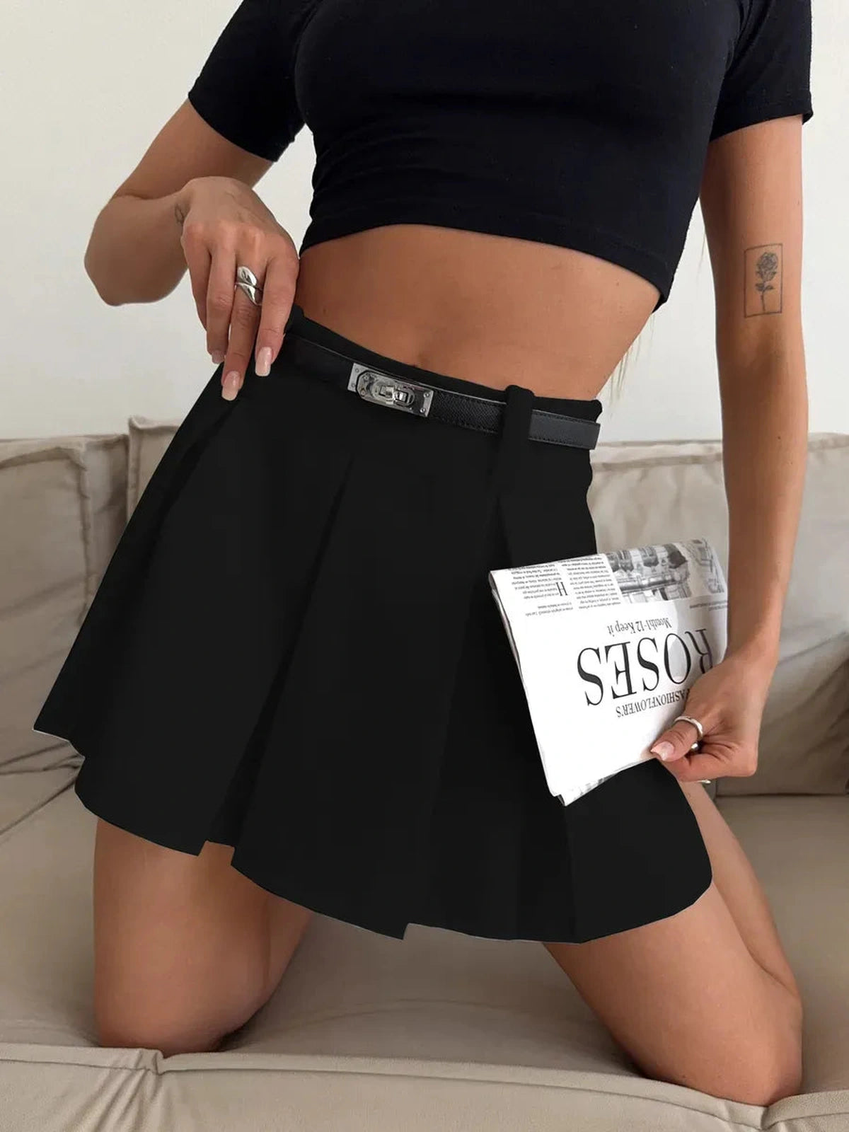 Noir Mini Skirt by Lauven - Black high-waisted pleated skort with built-in shorts, showcasing sleek sophistication.