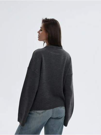 Aria Sweater by Lauven, oversized knit in anthracite gray, showcasing a stylish back view on a model.