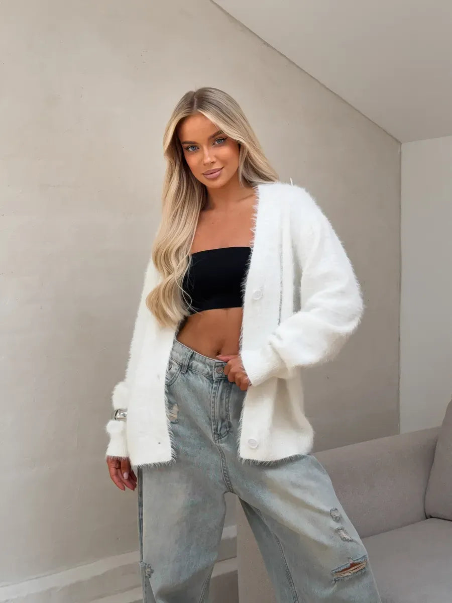 Luna Cardigan by Lauven, oversized white fluffy knit cardigan with button closure, styled with casual jeans.