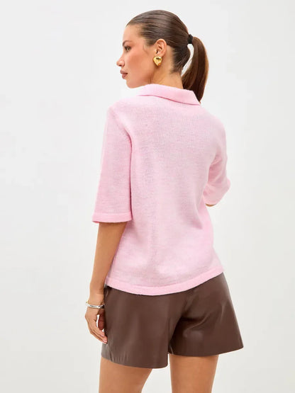 Back view of model wearing the Lauven Vera Cardigan, a lightweight pink wool blend knitwear.