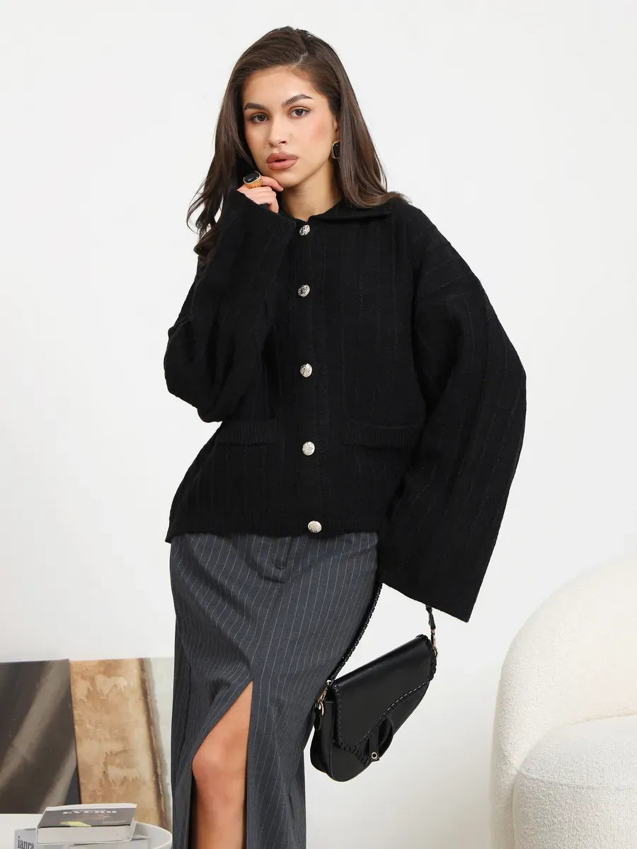 Onyx Cardigan by Lauven – Chic black oversized knitwear featuring a braided pattern and wide sleeves for sophisticated layering.
