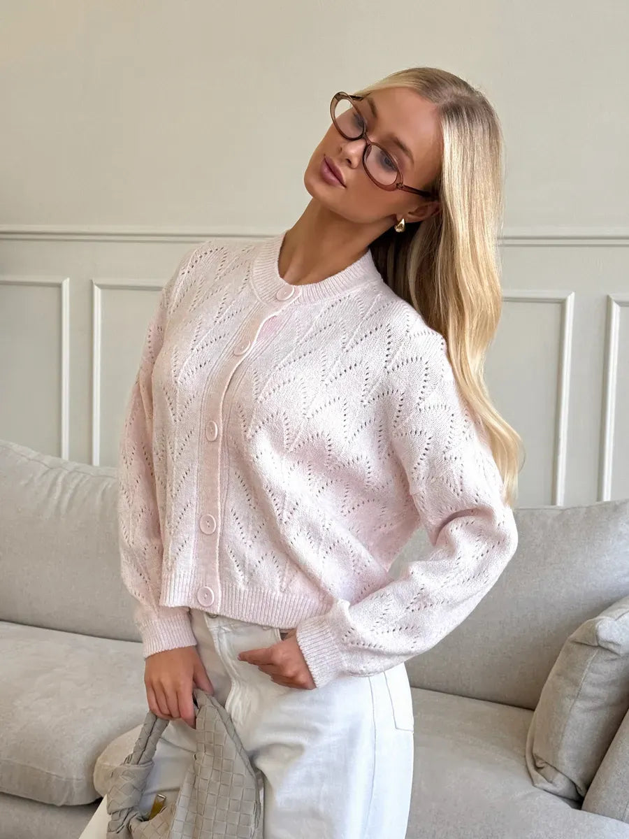Lauven Blush Cardigan with openwork lace design, soft pink knit texture, perfect for layering and adding elegance.