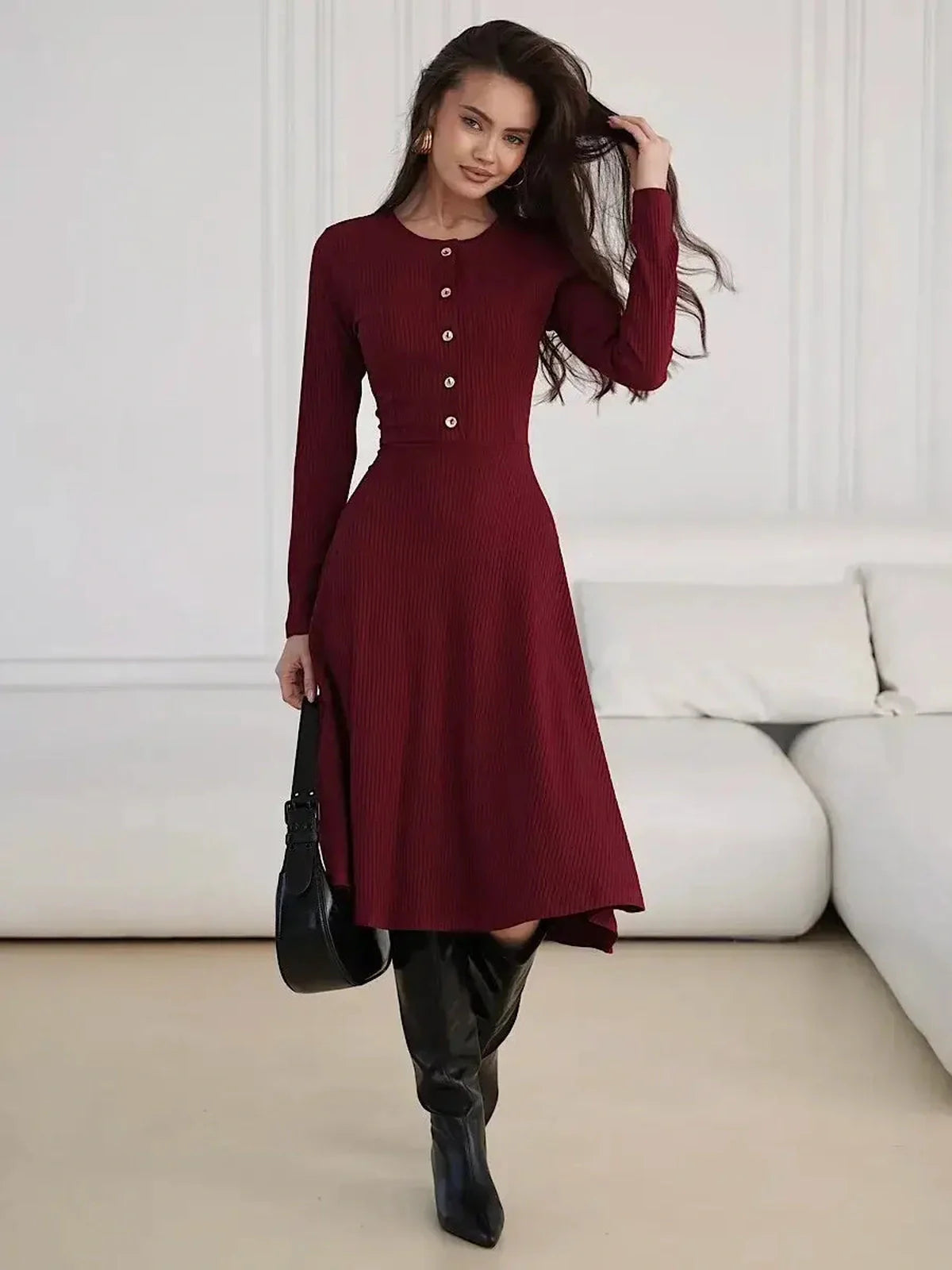 Crimson Grace Midi Dress with ribbed texture and gold button detail in burgundy, styled with sleek boots.