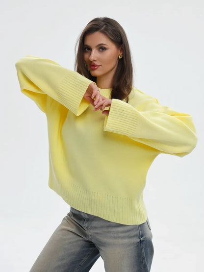 Stylish model wearing the Solara Sweater by Lauven in light yellow, showcasing oversized knit fashion.