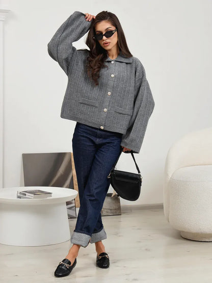 Slate Cardigan by Lauven, stylish oversized dark gray knitwear with braided detail, ideal for spring layering.