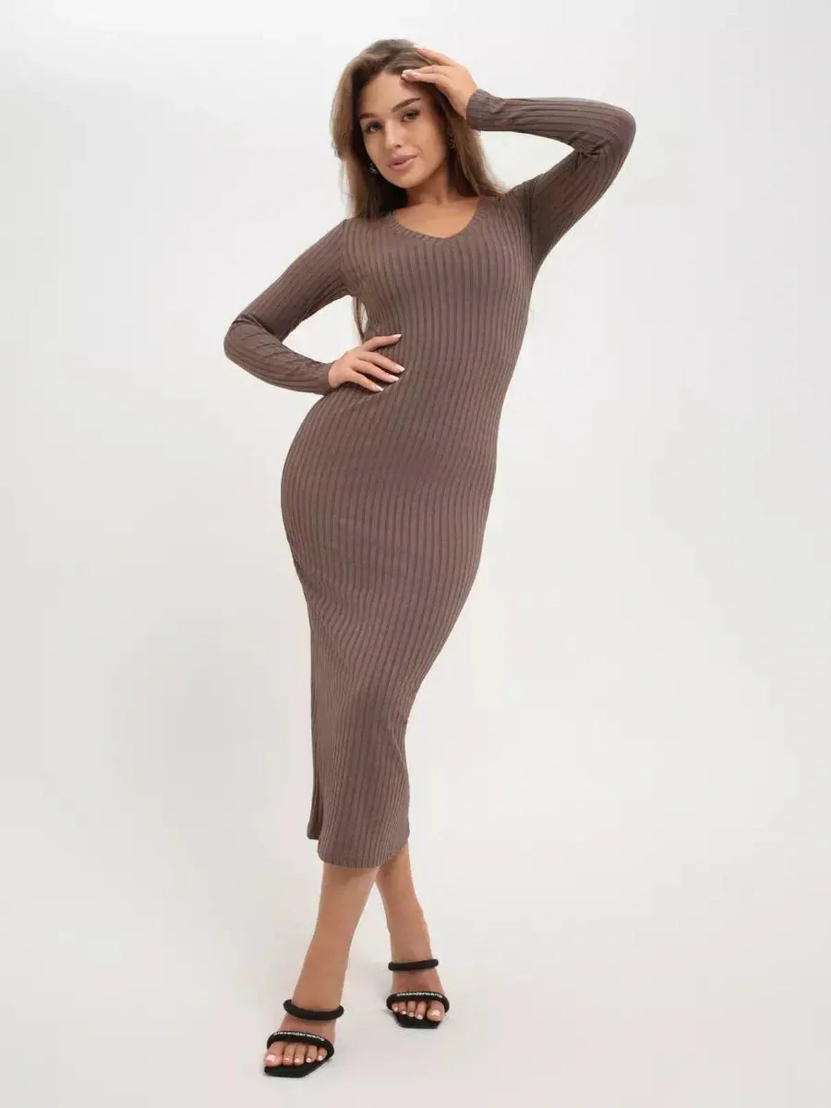 Model wearing a sleek ribbed Contour Midi Dress in brown, showcasing its sculpted fit and elegant style.