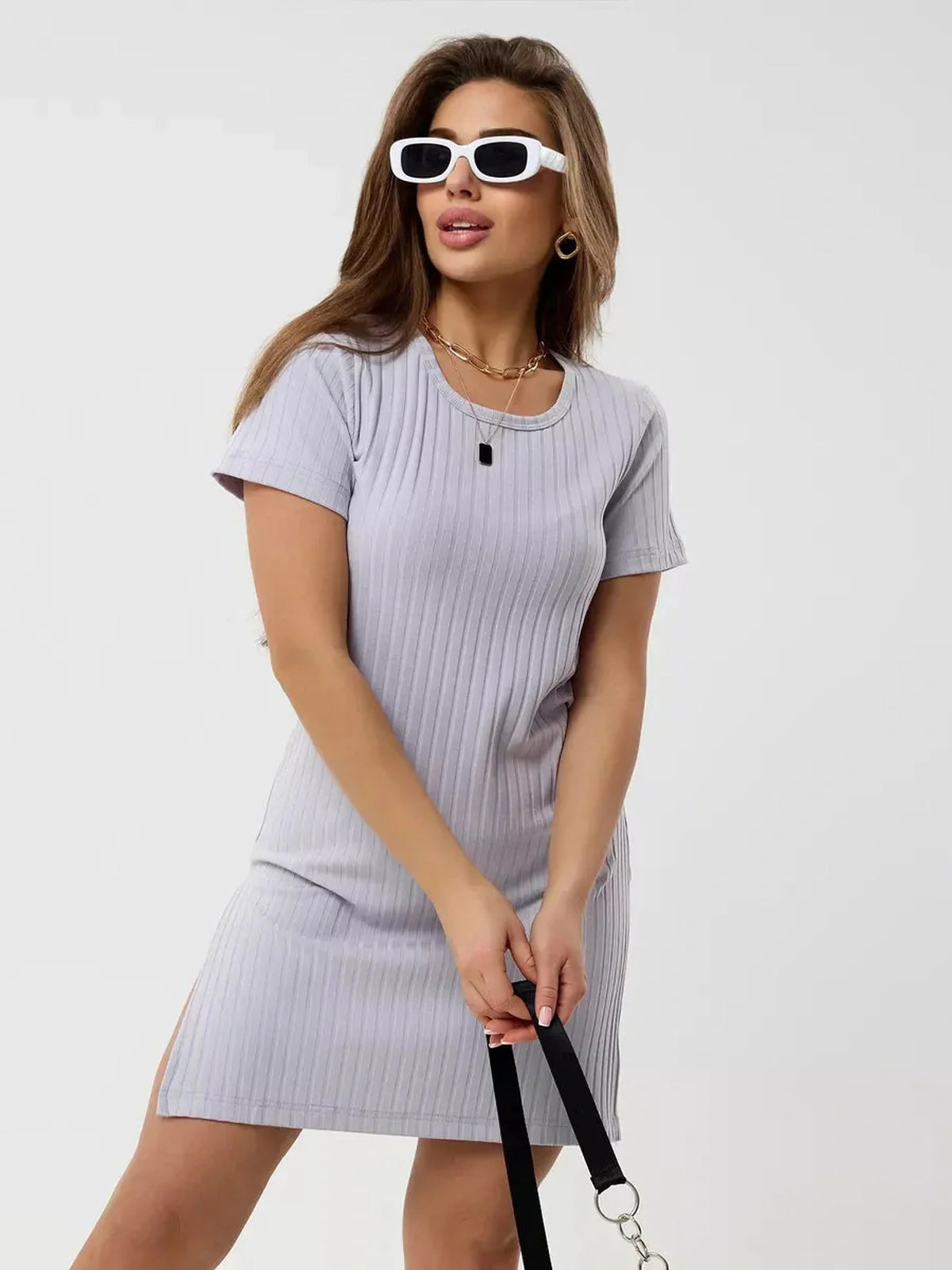 Model wearing a ribbed Cloudline Mini dress in light gray, showcasing its short sleeves and casual style.