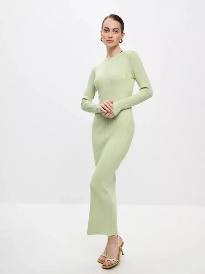 Model showcasing the Celery Luxe Maxi Dress in light green, highlighting its ribbed knit and seamless silhouette.