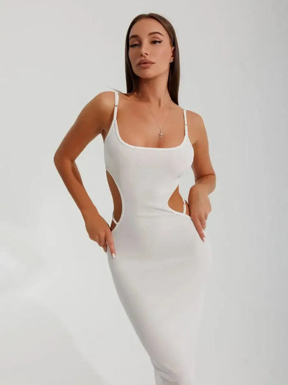 Woman in white midi dress with side cutouts, showcasing a sleek silhouette and elegant design.