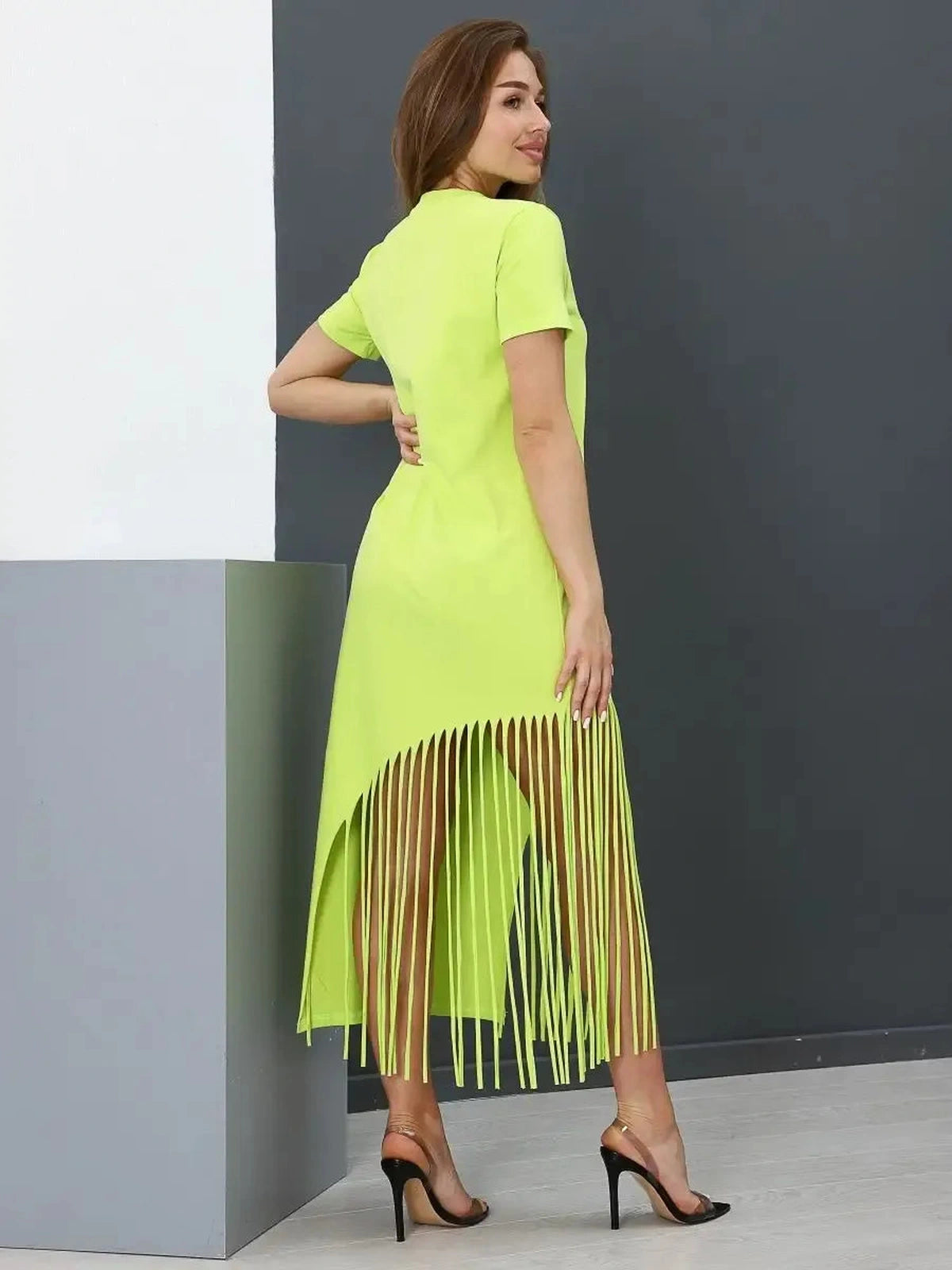 Luma Midi Dress by Lauven in lime cotton with fringe hem, showcasing a relaxed fit and modern style.