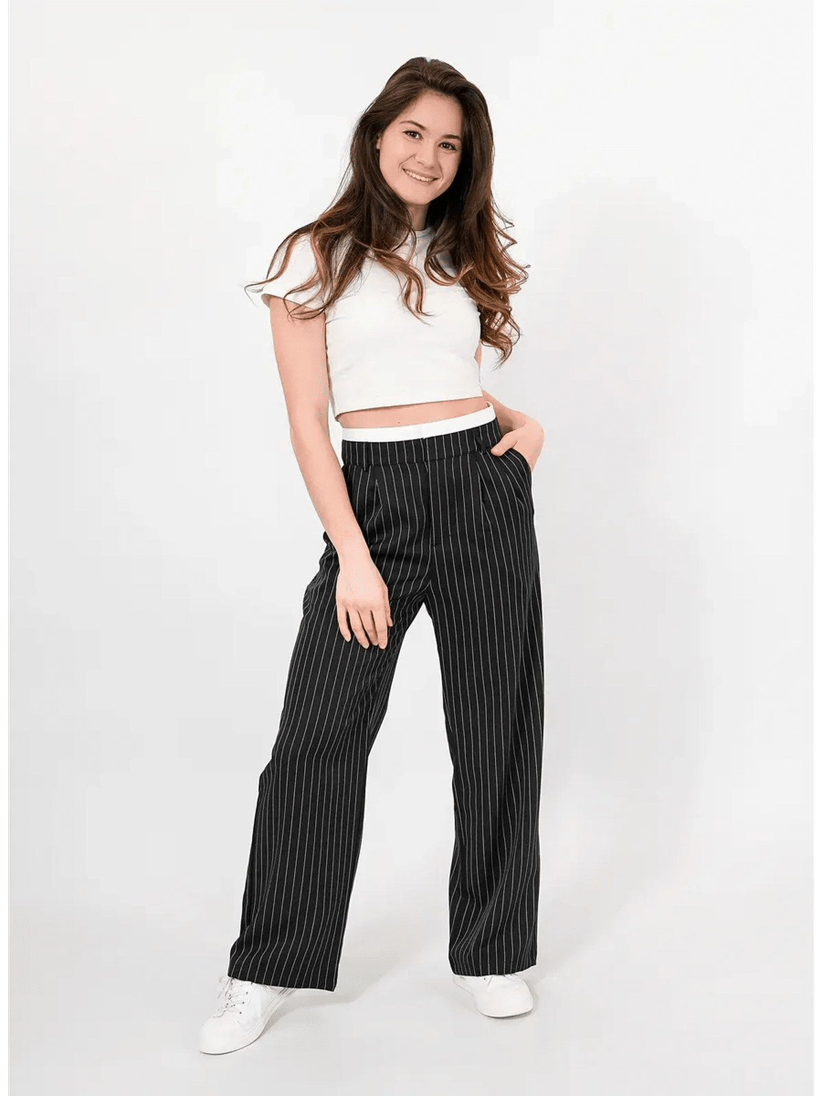 Model wearing Lauven Orion Pinstripe Pants featuring a high-waist wide-leg design and elegant pinstripes.