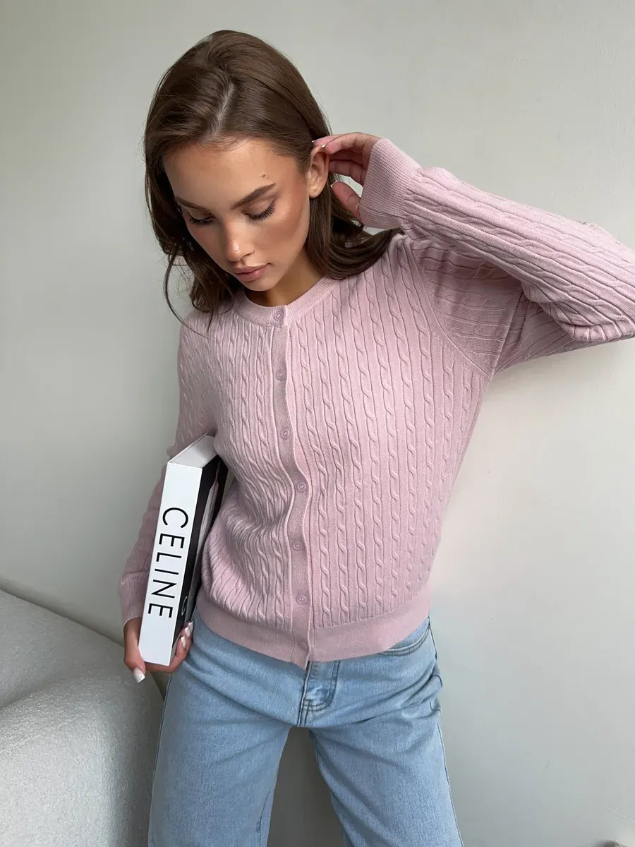 Model wearing a Rosewood Cardigan by Lauven, showcasing lightweight pink cable knit knitwear with casual style.