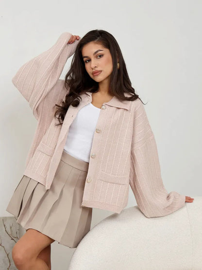 Lauven Serene Cardigan in soft powder pink, oversized knitwear with braided detail styled with a light outfit.