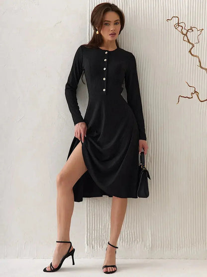 Serene Grace Midi Dress in black ribbed fabric featuring decorative buttons and a flared skirt, perfect for day to night wear.