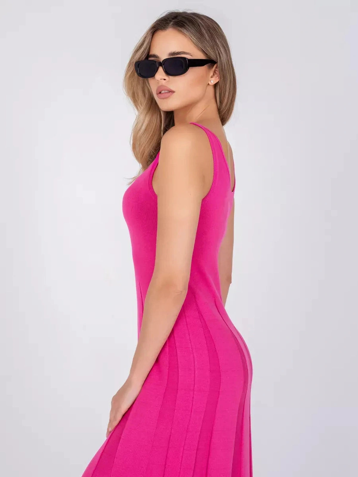 Lyra Maxi Dress by Lauven, featuring a vibrant fuchsia color and sleek A-line silhouette, showcasing modern femininity.