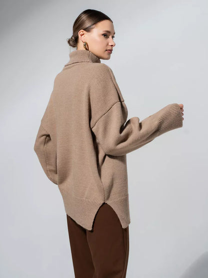 A model showcasing the Lauven Capri Sweater, an oversized knit with a turtleneck collar in warm cappuccino.