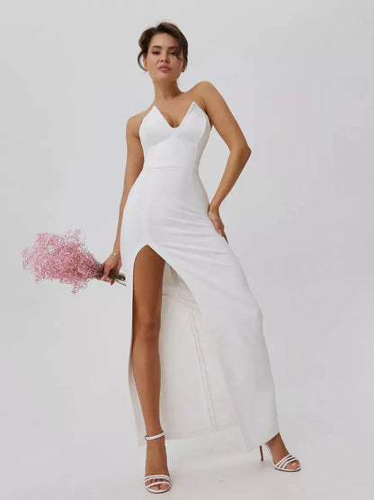 Lunaria Maxi Dress by Lauven, showcasing minimalist elegance with a sculpted fit and front slit in pristine white.
