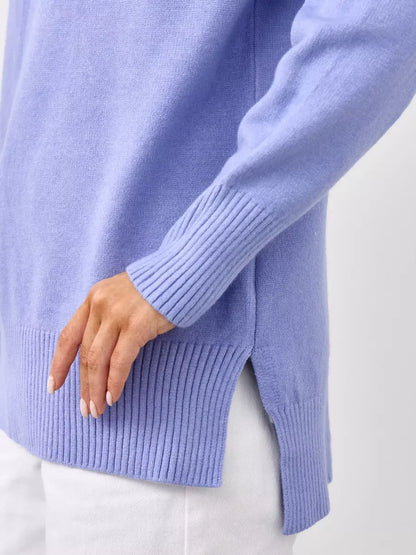 Close-up of the Lilac Sweater by Lauven, showcasing oversized lavender cashmere knitwear with ribbed detailing.