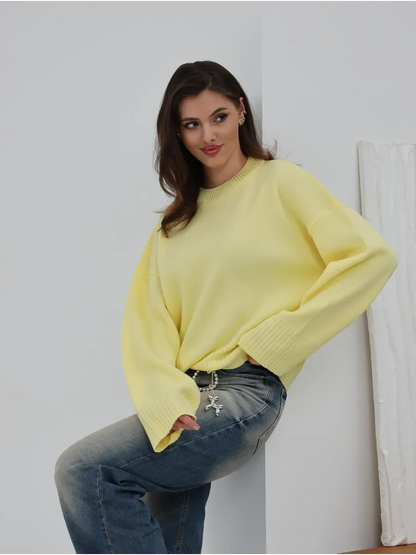 Light yellow oversized knitwear styled with jeans, featuring the Solara Sweater by Lauven.