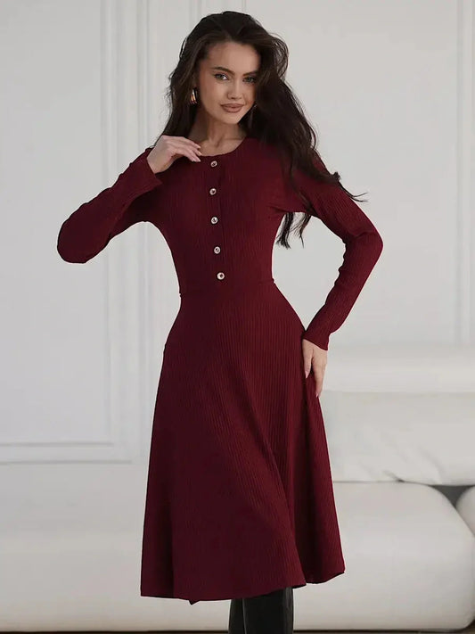 Crimson Grace Midi Dress in ribbed burgundy with gold buttons, showcasing elegance and versatility.