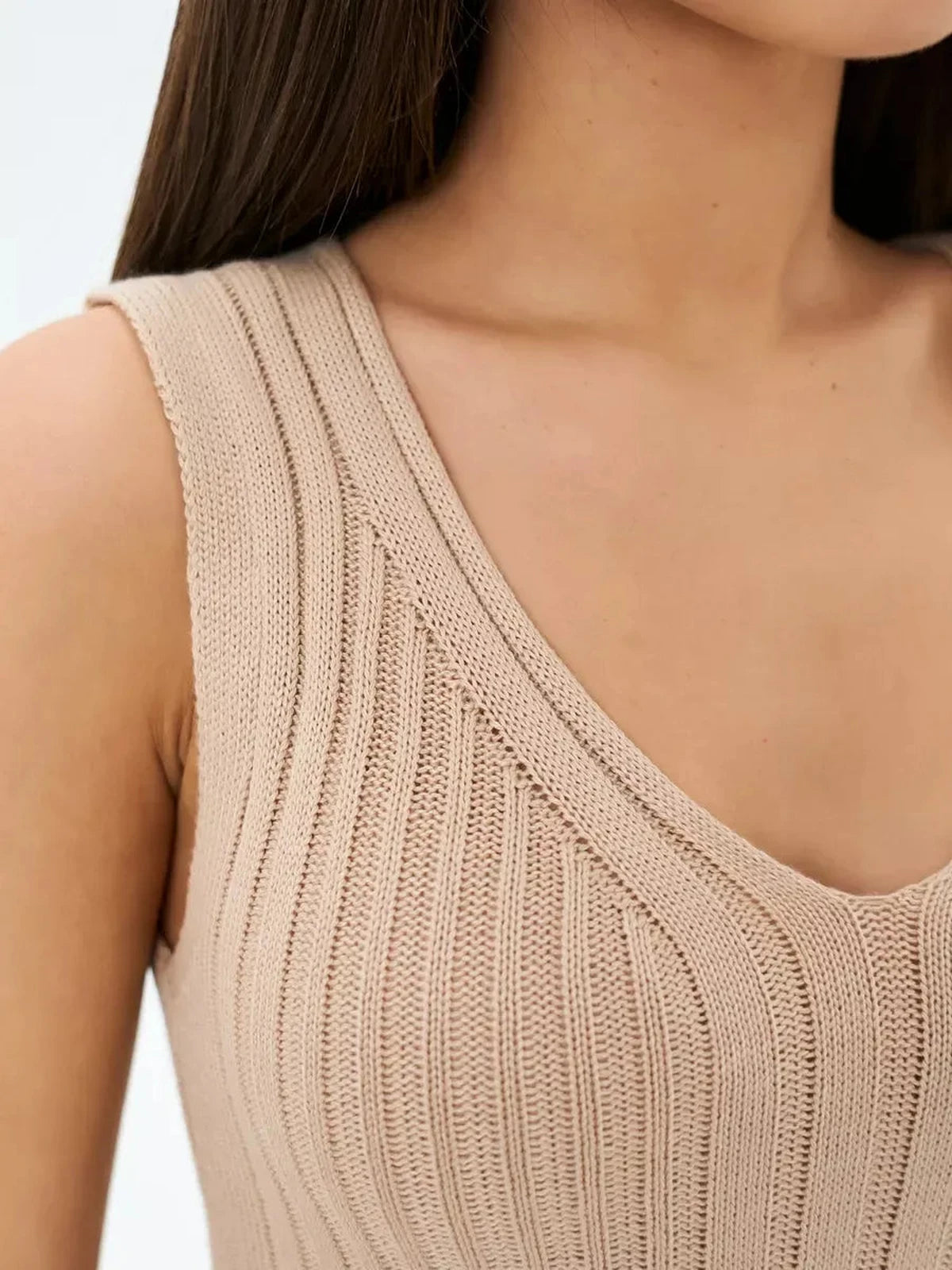 Sahara Midi Dress by Lauven showcasing ribbed knit detail in soft beige with a flattering V-neckline.