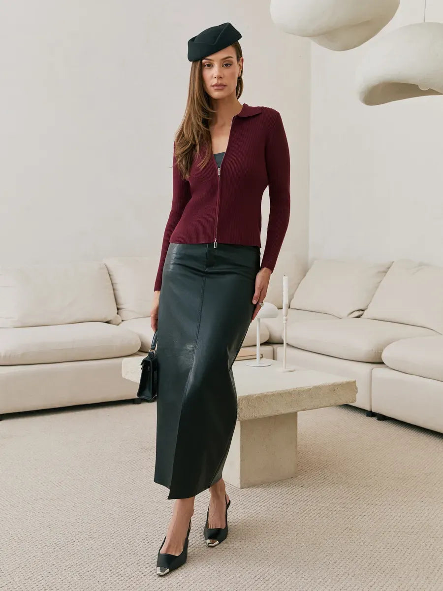 Arden Cardigan in wine red worn with a sleek black skirt, showcasing modern knitwear style by Lauven.