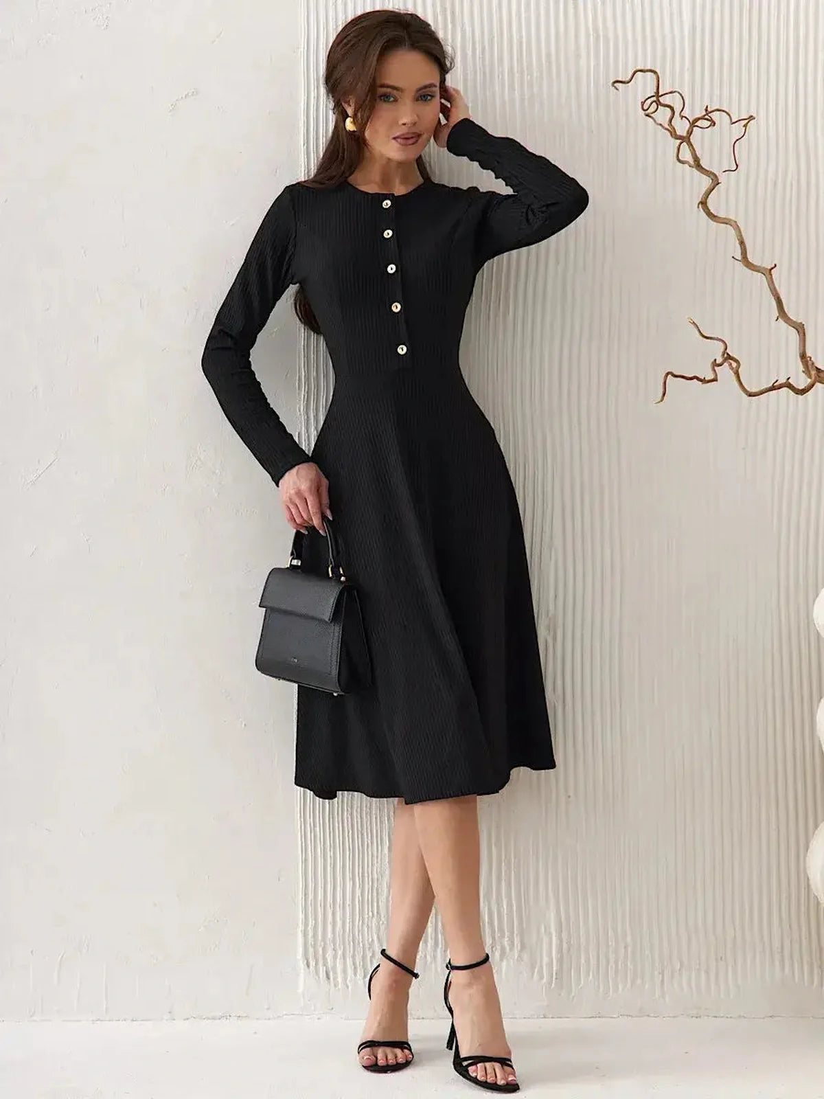 Serene Grace Midi Dress in black, featuring decorative buttons and a tailored silhouette, perfect for elegant occasions.