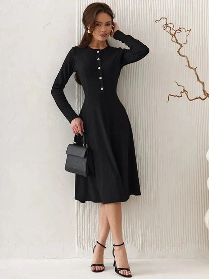 Serene Grace Midi Dress in black, featuring decorative buttons and a tailored silhouette, perfect for elegant occasions.