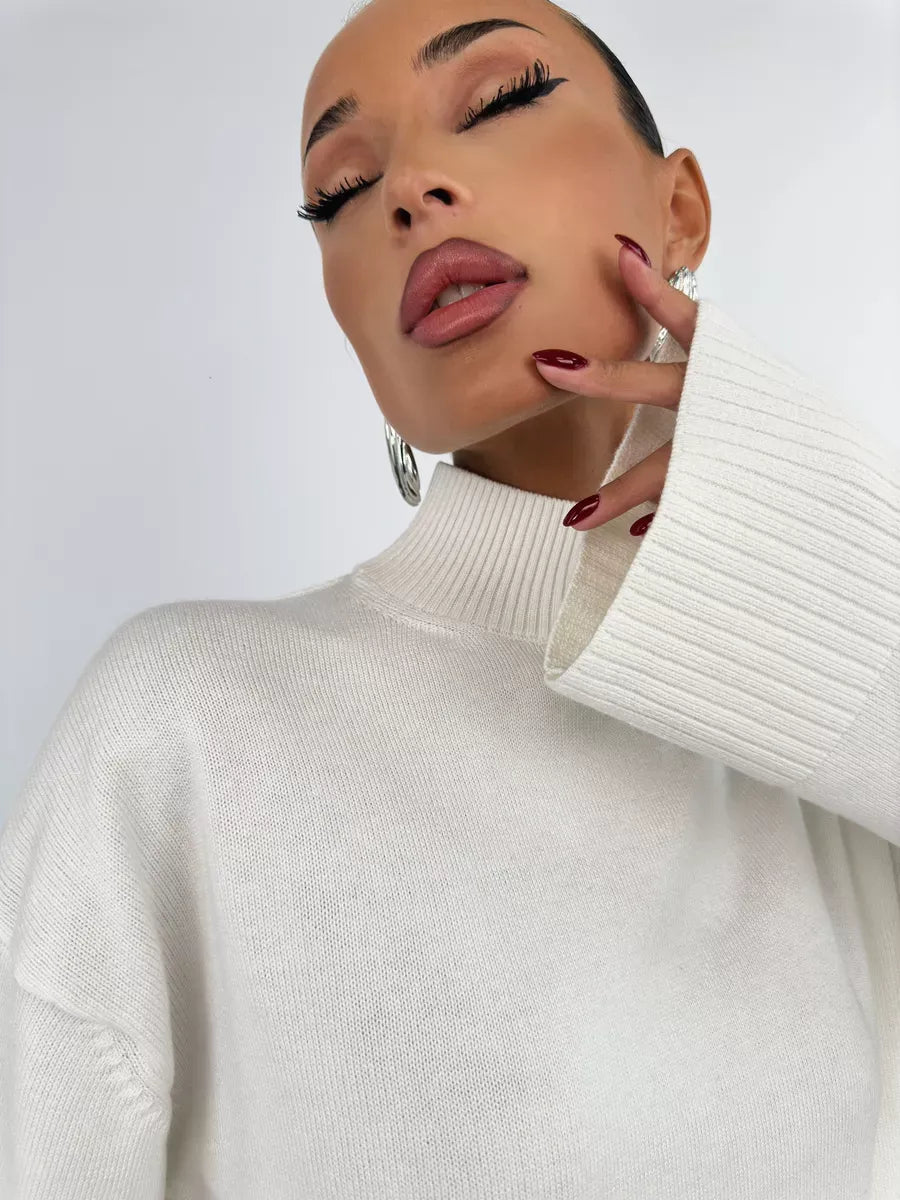 Bianca Sweater by Lauven in white, oversized knitwear with high neck, showcasing elegance and comfort.