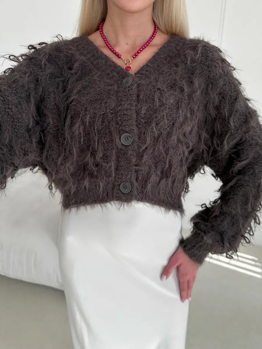 Espresso Cardigan by Lauven, cropped oversized brown bouclé knit with feathered fringe and V-neckline.